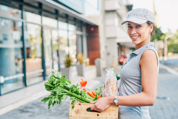 Structured grocery list and reusable bags on kitchen counter